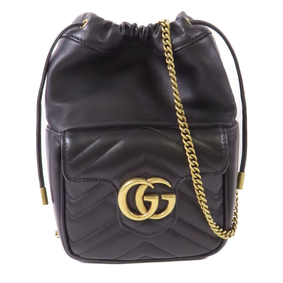 Gucci GG Marmont mini bucket shoulder bag black calfskin chain strap: Gucci GG Marmont mini bucket shoulder bag black calfskin chain strap A Gucci GG Marmont Mini Bucket Shoulder Chain Bag in black calfskin leather with gold-tone hardware. This bag features a magnetic o