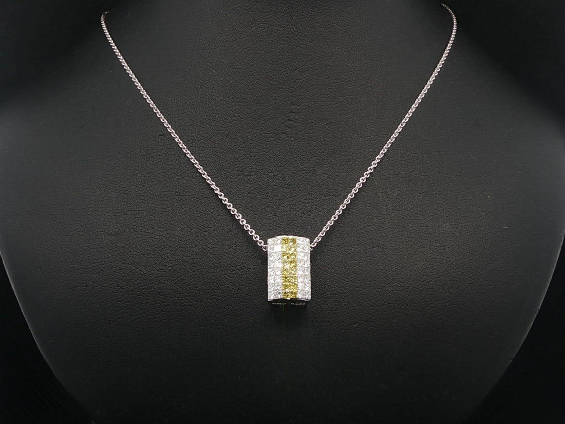 18K White Gold 1.20ctw Invisible Set Yellow White Diamond Pendant Necklace: 18K White Gold 1.20ctw Invisible Set Yellow White Diamond Pendant Necklace This exquisite 18k White Gold Slide Pendant Necklace features a stunning design adorned with a total of 1.20 carats of natura