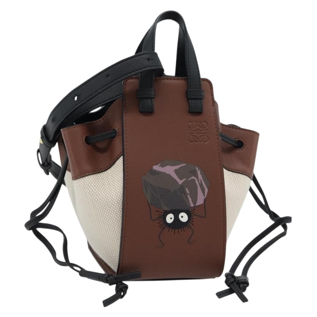 LOEWE Studio Ghibli Spirited Away Hammock Mini Leather Hand Bag: LOEWE Studio Ghibli Spirited Away Hammock Mini Leather Hand Bag A LOEWE x Studio Ghibli Spirited Away Soot Sprites Hammock Mini handbag in beige leather, made in Spain. It comes with a dust bag and sh