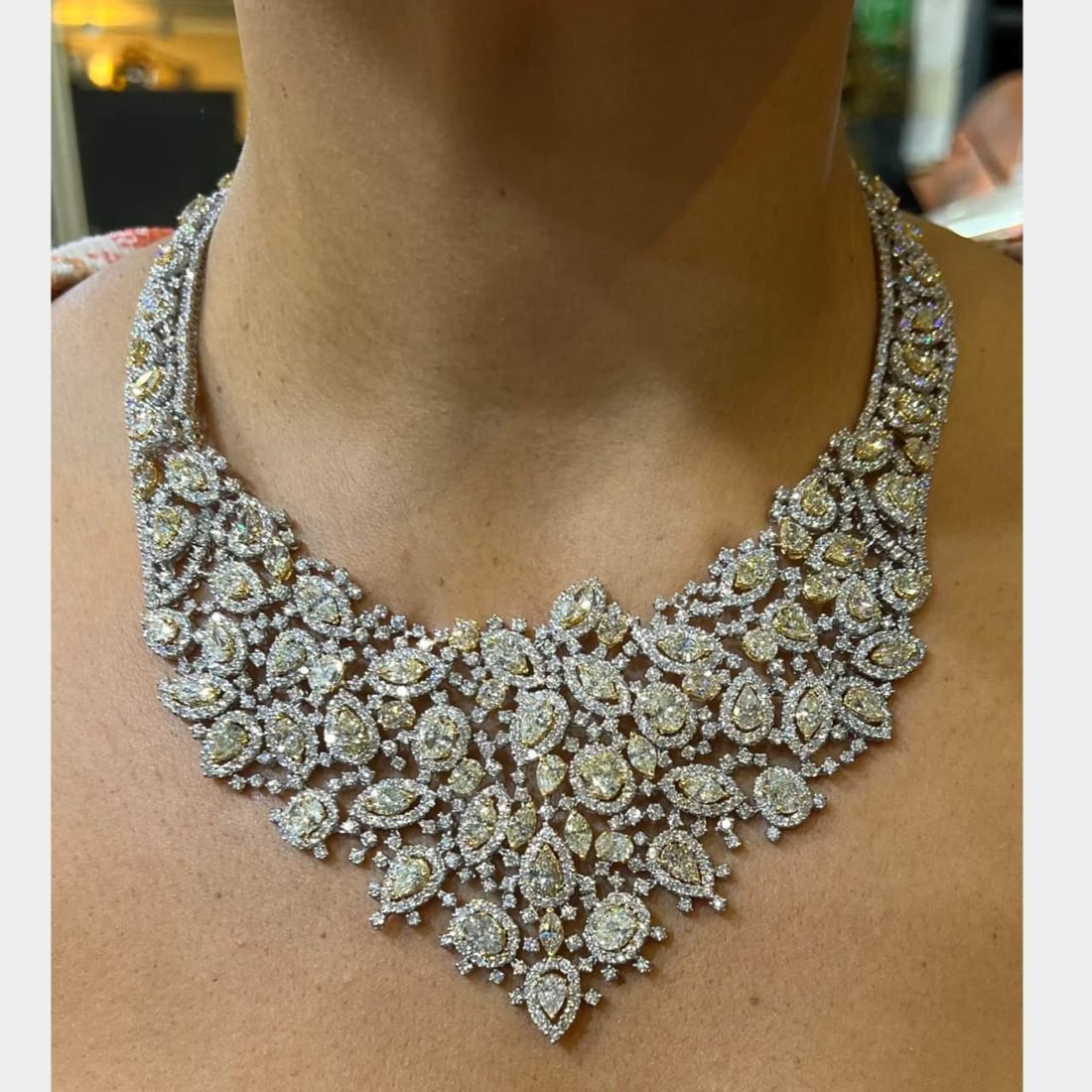 Stunning 18K White Gold 108.50 Ct Fancy Diamond Necklace: Stunning 18K White Gold 108.50 Ct Fancy Diamond Necklace Exquisite 18K White Gold Necklace featuring a stunning 108.50 Ct. total diamond weight. This elegant piece weighs 196.4 grams and is adorned wi