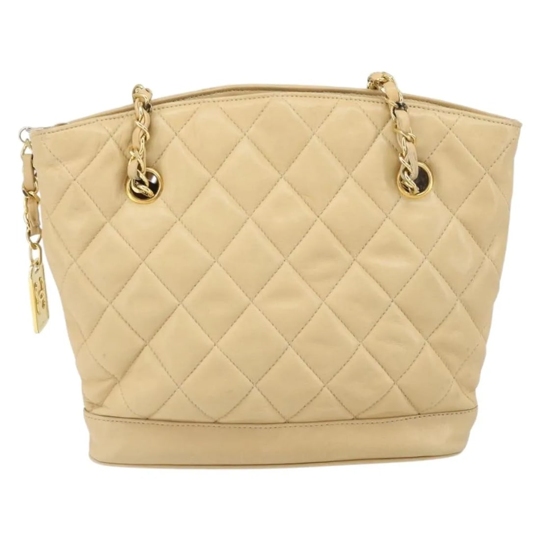 Chanel Vintage CC Leather Shopper Chain Bag: Chanel Vintage CC Leather Shopper Chain Bag This Chanel Vintage CC Chain Shopper is crafted from quilted beige leather and features the iconic CC logo with chain handles. Made in Italy, this shopper i