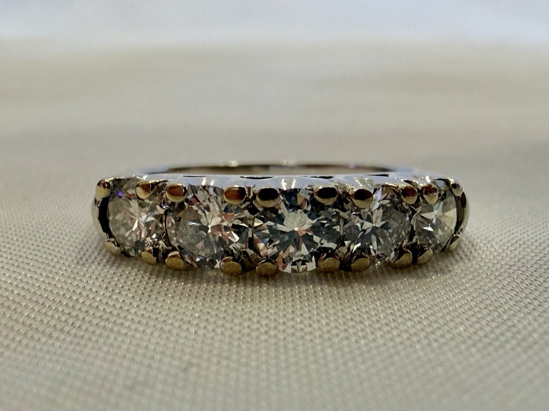 Diamond Platinum Ring with Five Stones Size 6: Diamond Platinum Ring with Five Stones Size 6 This platinum diamond ring features five diamonds set in a finely crafted design. The ring is size 6 and showcases exquisite detail and workmanship. It we