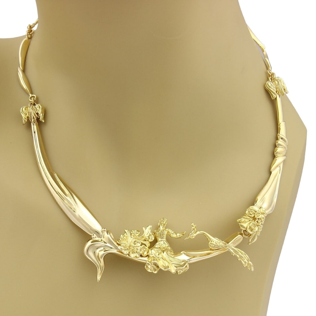 14k Yellow Gold Figural Collar Necklace Woman and Peacock Motif: 14k Yellow Gold Figural Collar Necklace Woman and Peacock Motif This vintage estate collar necklace is crafted in solid 14k yellow gold and features a sculptural link design centered by a figural woma