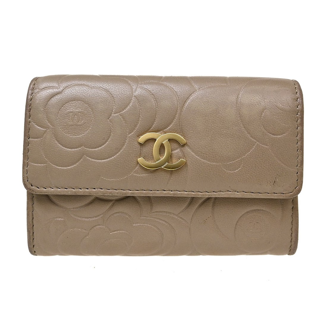 CHANEL Camellia Beige Lambskin Card Wallet Italy: CHANEL Camellia Beige Lambskin Card Wallet Italy Beige Chanel card wallet in lambskin leather with camellia detailing and logo accent. Made in Italy, this women's cardholder has one interior pocket an