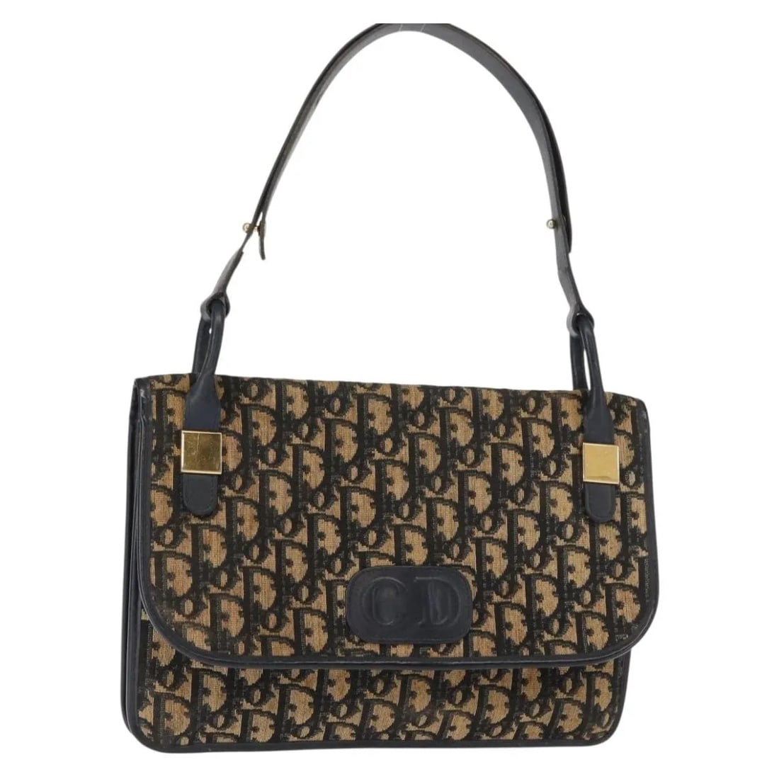 Christian Dior Vintage Trotter Navy Canvas Shoulder Bag: Christian Dior Vintage Trotter Navy Canvas Shoulder Bag This pre-owned Christian Dior Vintage Trotter shoulder bag for women features navy canvas material with leather accents. It measures 27cm x 20cm