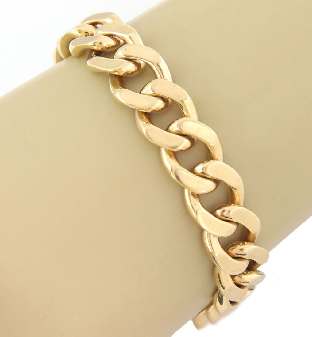 Unbranded 14k Yellow Gold Cuban Link Bracelet 8.5 in Italy: Unbranded 14k Yellow Gold Cuban Link Bracelet 8.5 in Italy This pre-owned estate Cuban link bracelet is crafted in 14k yellow gold and features bold polished links with a secure clasp. It is described
