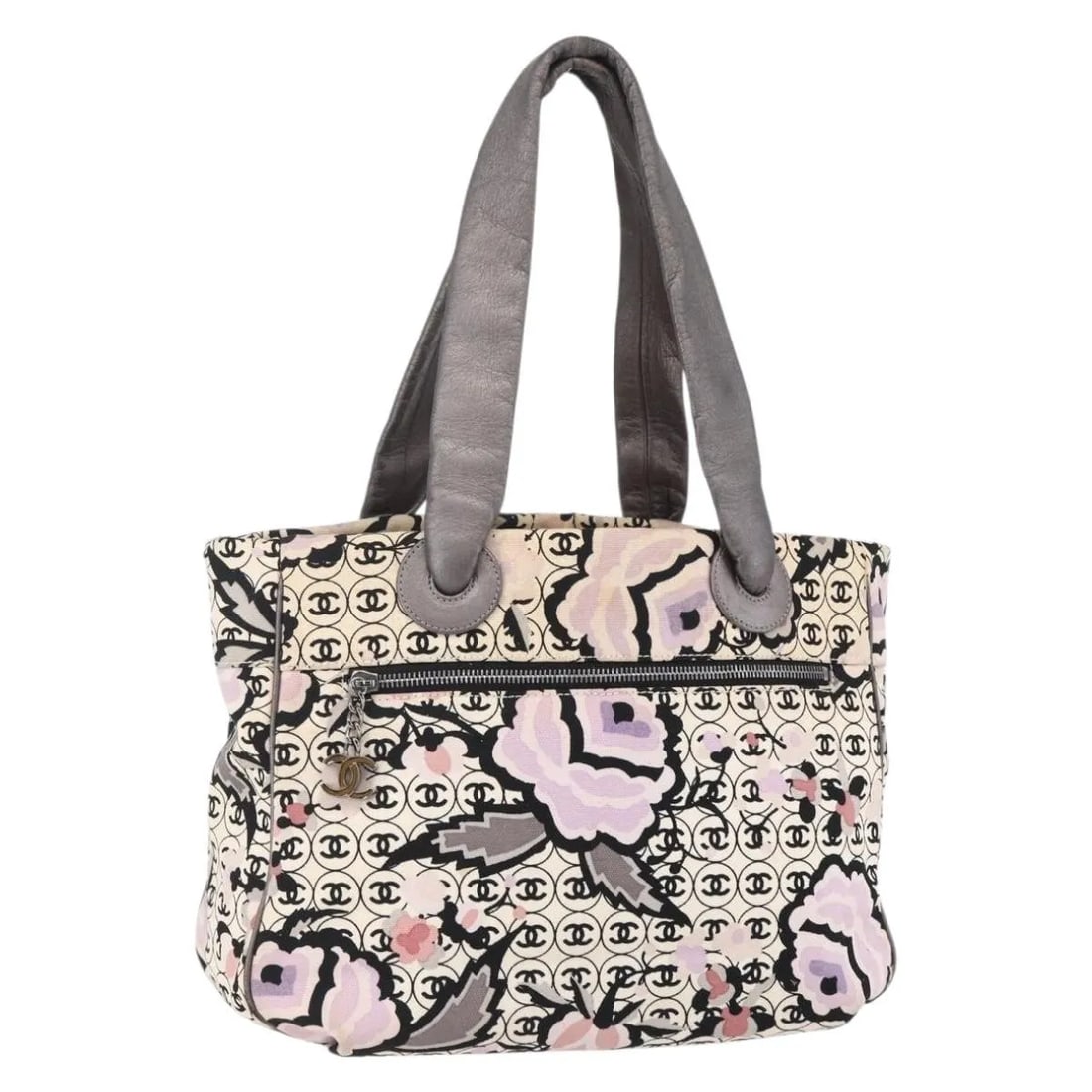 Chanel Beige Canvas Vintage Floral Tote Bag from Italy: Chanel Beige Canvas Vintage Floral Tote Bag from Italy This Chanel Vintage Floral Tote is crafted from beige canvas and designed for women. The tote features floral details and displays signs of use, 