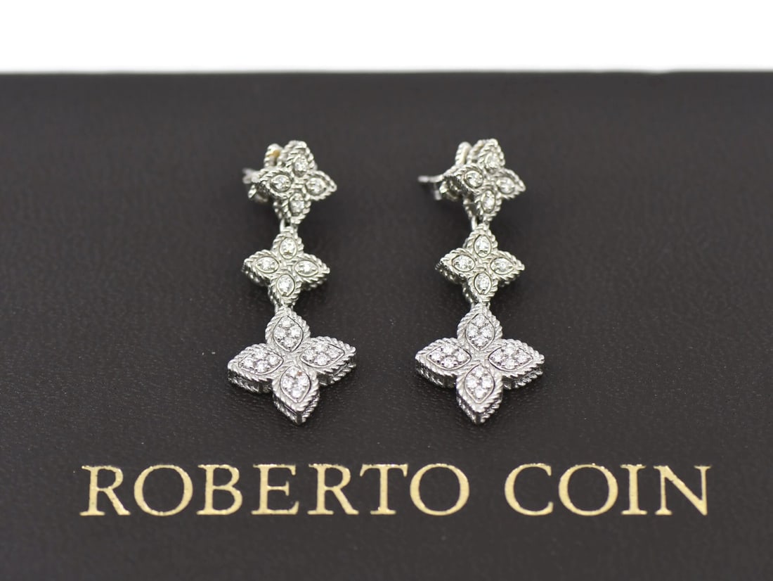 Princess Flower Diamond Earrings in 18K White Gold by Roberto Coin: Princess Flower Diamond Earrings in 18K White Gold by Roberto Coin These pre-owned Roberto Coin Princess Flower earrings feature a floral dangle design crafted from 18K white gold. The earrings are se