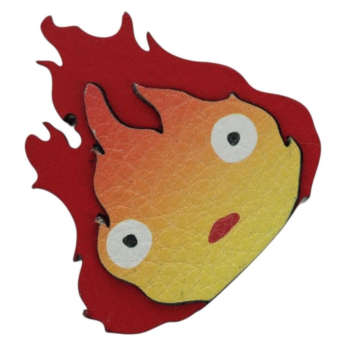 LOEWE Calcifer leather bag charm with dust bag and box: LOEWE Calcifer leather bag charm with dust bag and box This LOEWE x Studio Ghibli Howl's Moving Castle Calcifer bag charm features a vibrant red leather design inspired by the beloved character Calcif