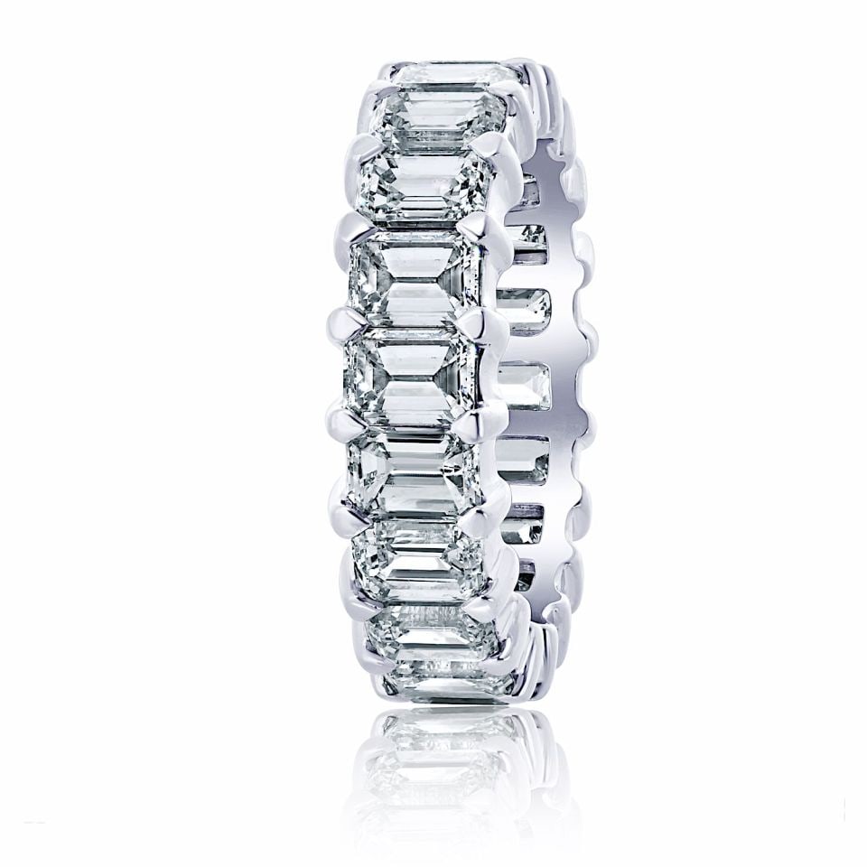 14K White Gold 7ct Emerald Cut Diamond Eternity Band with IGI Report: 14K White Gold 7ct Emerald Cut Diamond Eternity Band with IGI Report This exquisite eternity band is crafted in 14K white gold and features 20 natural emerald-cut diamonds with a total approximate