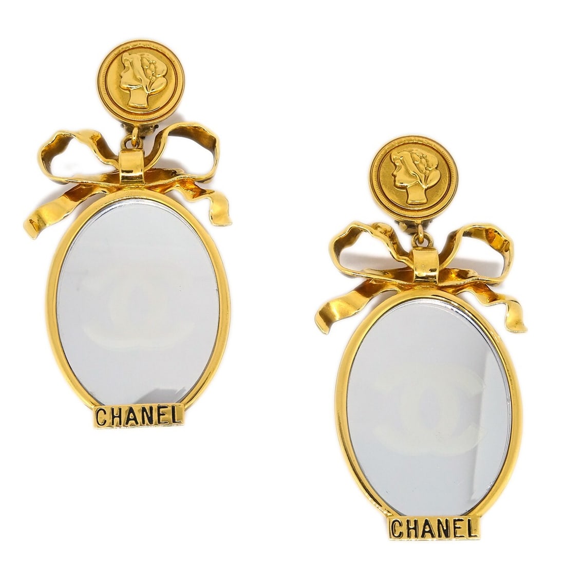 CHANEL Gold Plated Clip-On Dangle Earrings: CHANEL Gold Plated Clip-On Dangle Earrings Chanel clip-on dangle earrings in gold-plated metal with a mirror-style design. Made in France, these earrings show reasonable wear and tear with dirt and sc