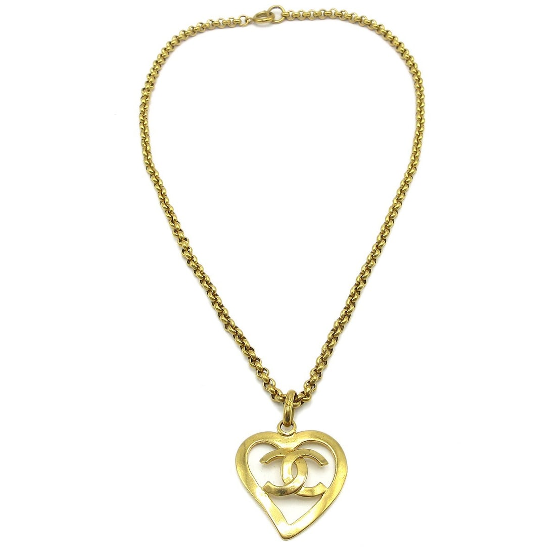 Vintage Chanel 95P Gold Plated Heart Charm Pendant Necklace: Vintage Chanel 95P Gold Plated Heart Charm Pendant Necklace Vintage Chanel pendant necklace with a heart-shaped charm and CC logo design. The gold-plated necklace is marked 95P and shows reasonable we