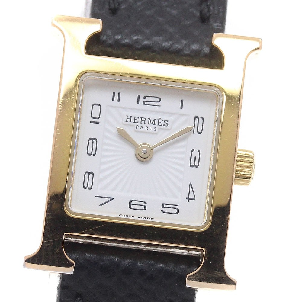 Hermes HH1.101 H Watch Mini Women's Quartz Wristwatch: Hermes HH1.101 H Watch Mini Women's Quartz Wristwatch Pre-owned HERMES H-Watch Mini women's wristwatch with a quartz movement and white dial. It features an SS/GP case, leather belt, and comes with th