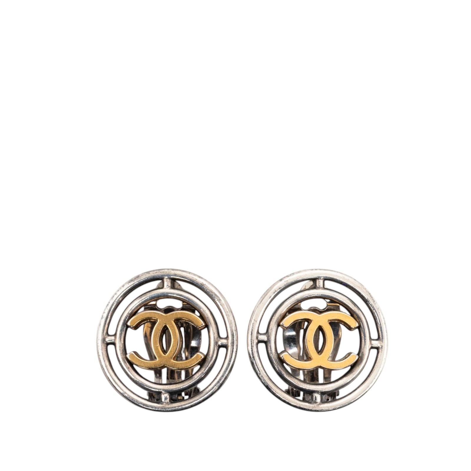 Chanel brass CC round wheel clip on earrings: Chanel brass CC round wheel clip on earrings These Chanel CC Brass Round Wheel Clip On Earrings feature brass hardware with a gold tone CC logo and secure clip-on closures. Crafted in France, these co