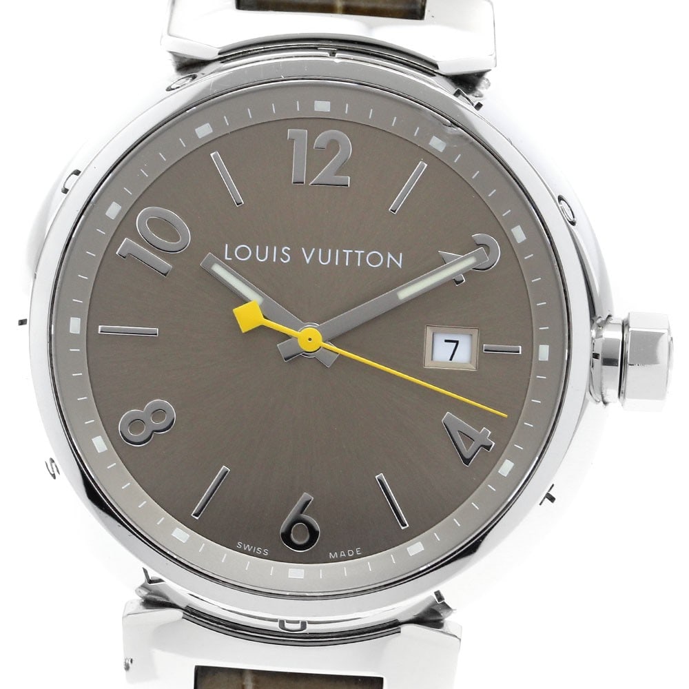Louis Vuitton Tambour Q1112 Quartz Date Men's Wristwatch: Louis Vuitton Tambour Q1112 Quartz Date Men's Wristwatch This Louis Vuitton Tambour Date Quartz men's wristwatch features a stainless steel case and a brown dial, complemented by a leather strap. It i