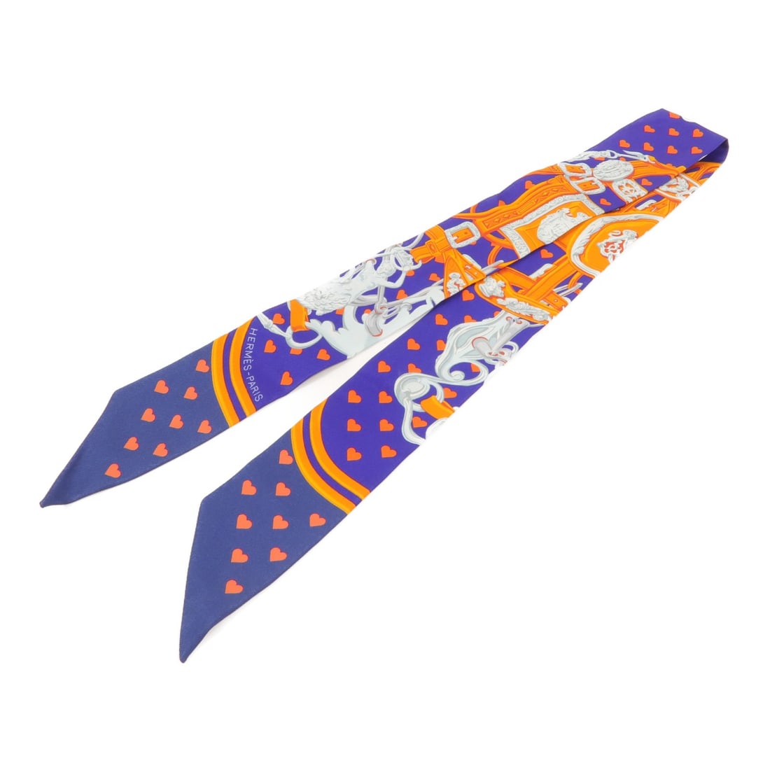 Hermes Twilly Silk Scarf Blue Orange 86cm x 5cm: Hermes Twilly Silk Scarf Blue Orange 86cm x 5cm Hermes Twilly scarf in silk with a blue and orange colorway. The item is in very good condition, graded AB, and measures 86 cm x 5 cm (33.9 in x 2.0 in)