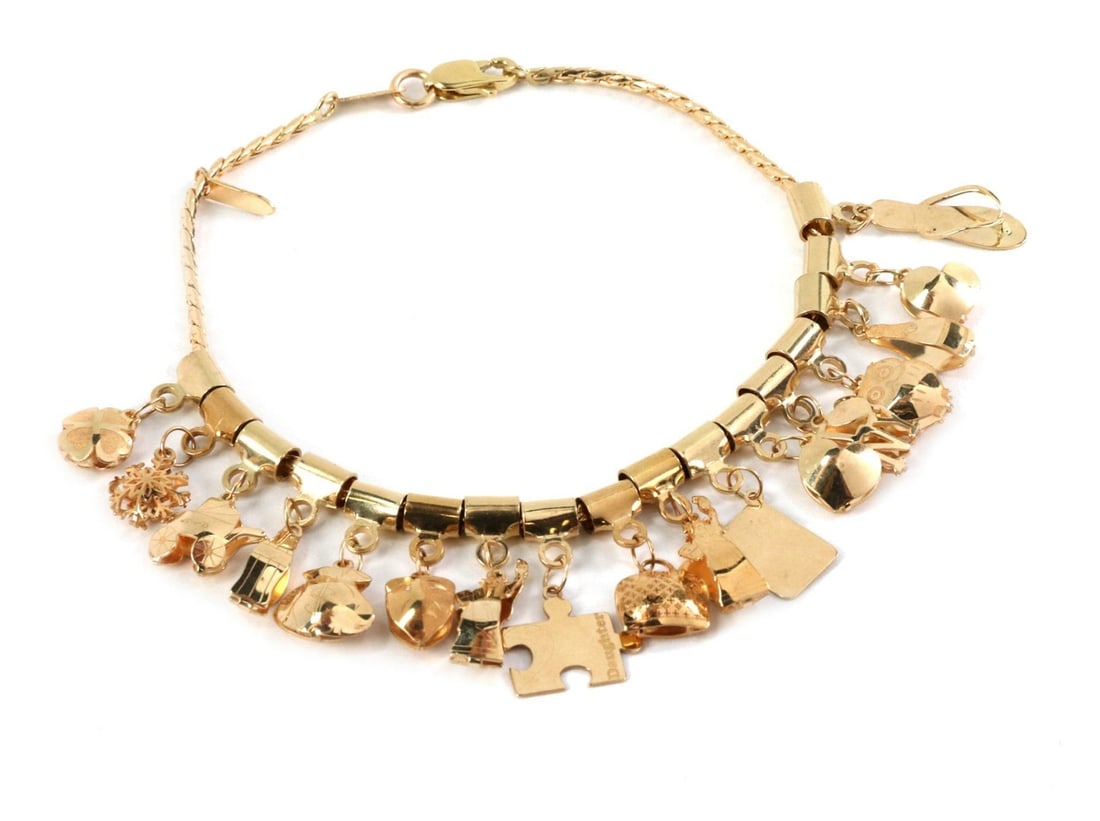 14k Yellow Gold 17 Charm Bracelet with Flowers Animals Handbags: 14k Yellow Gold 17 Charm Bracelet with Flowers Animals Handbags Adorn your wrist with this exquisite 14k Yellow Gold Dangling Multi-Charms Bracelet. This charming piece features a delightful assortmen