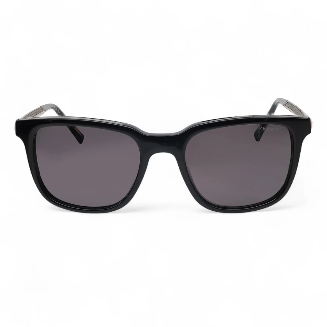 Chopard 95221-0521 Black Acetate Sunglasses with Smoke Polarized Lenses: Chopard 95221-0521 Black Acetate Sunglasses with Smoke Polarized Lenses Elevate your accessory collection with these luxurious Chopard Sunglasses model 95221-0521. Designed for the fashion-forward, th