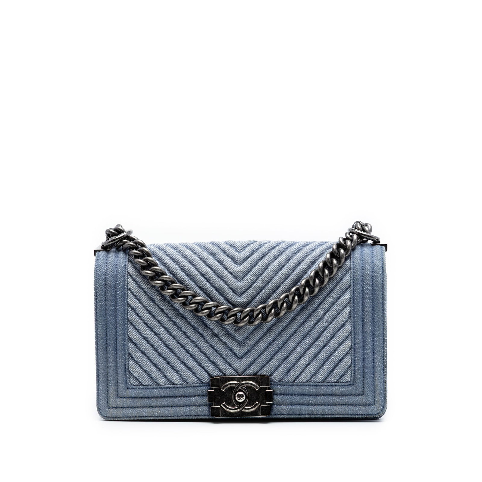 Chanel Boy Flap Old Medium Chevron Denim Shoulder Bag: Chanel Boy Flap Old Medium Chevron Denim Shoulder Bag This Chanel Old Medium Boy Flap bag is crafted in blue chevron quilted denim with a chain link strap and adjustable flat leather guard. It feature