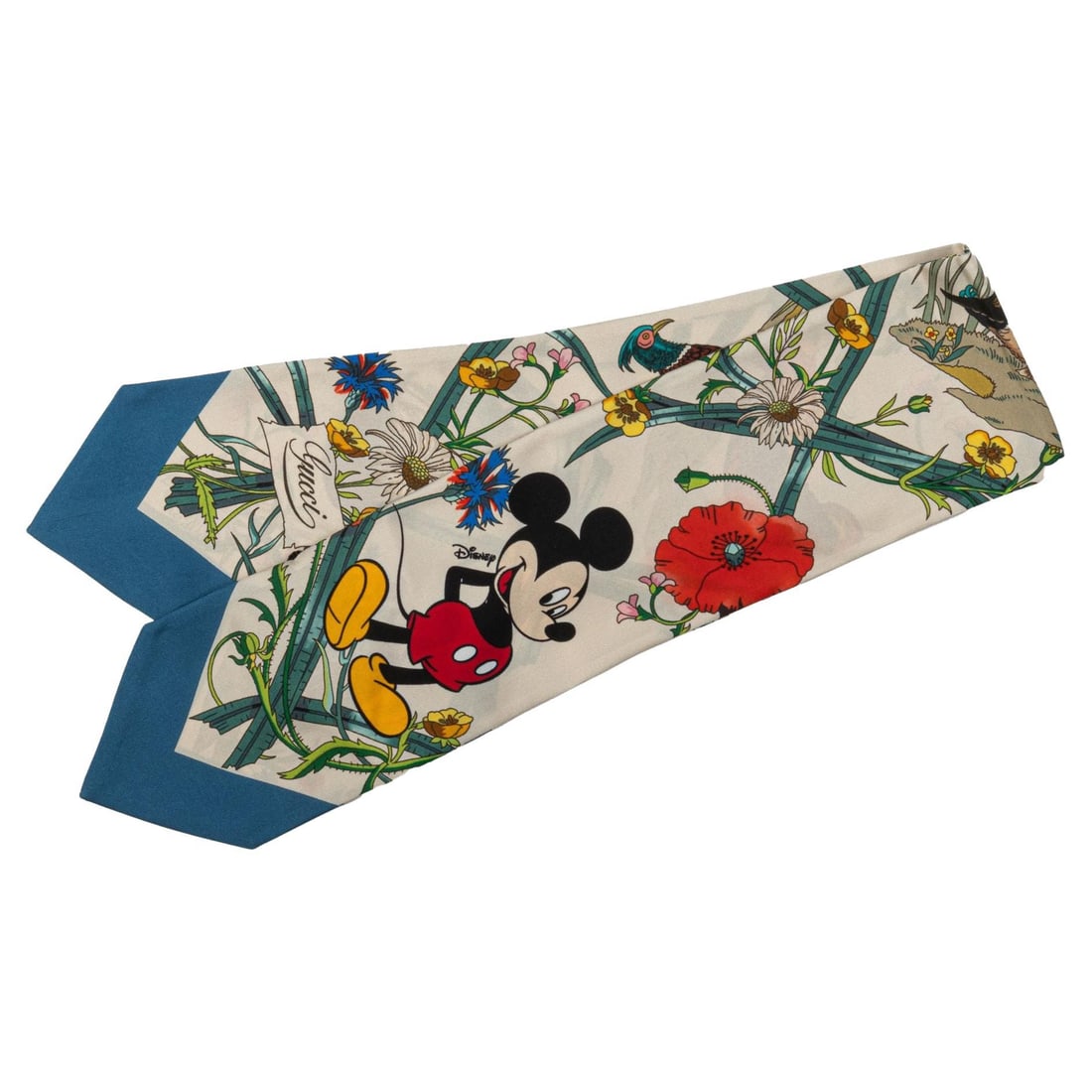 Gucci x Disney Limited Edition Silk Ascot Mickey Mouse 100% Silk: Gucci x Disney Limited Edition Silk Ascot Mickey Mouse 100% Silk Elevate your style with this Gucci x Disney limited edition Flora Silk Ascot, featuring a charming Mickey Mouse design. Crafted from 10