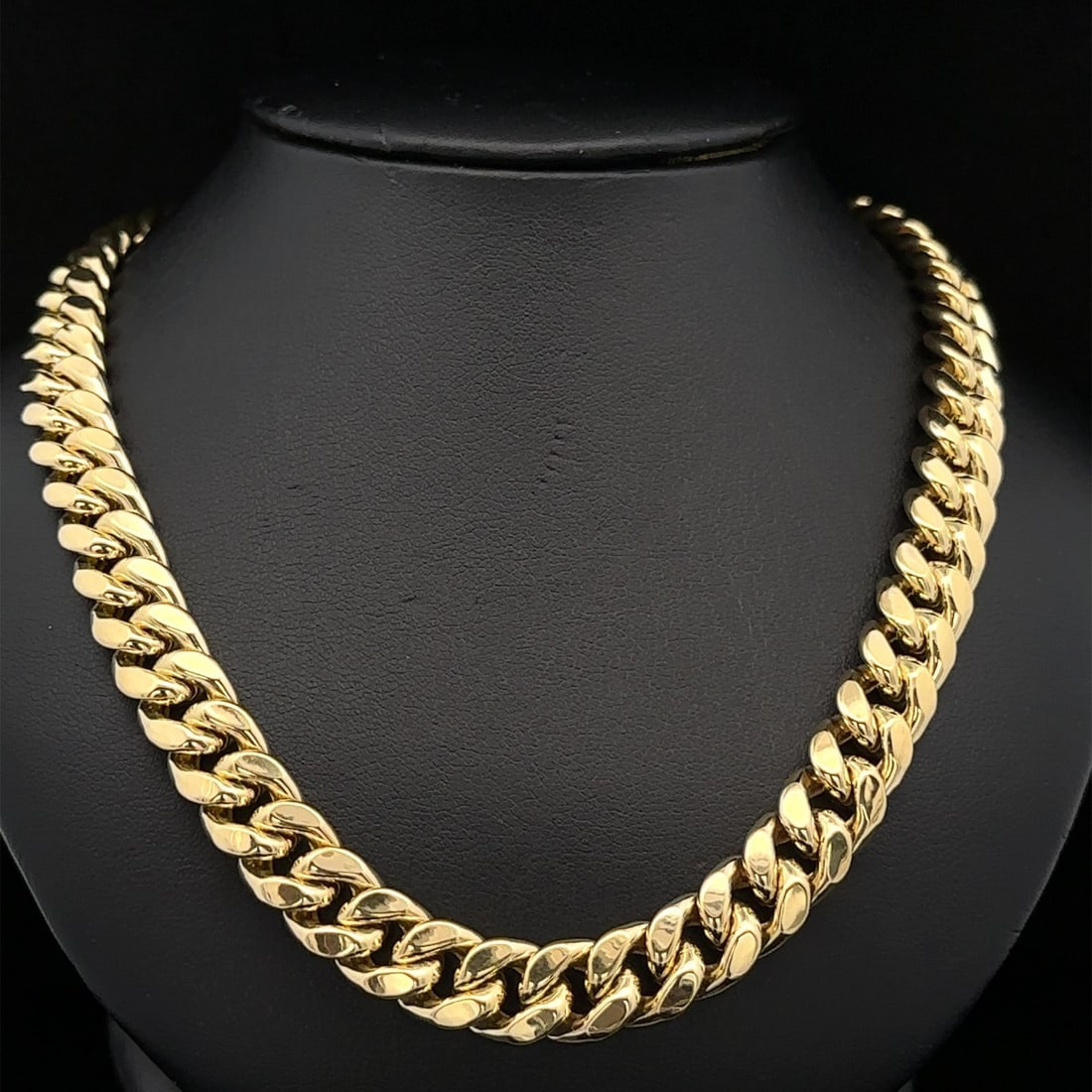 Men's 24 Inch 10k Yellow Gold Curb Cuban Link Chain Necklace: Men's 24 Inch 10k Yellow Gold Curb Cuban Link Chain Necklace This classic men's chain necklace is crafted from solid 10k yellow gold with a semi-hollow design. Featuring a curb Cuban link style, it me