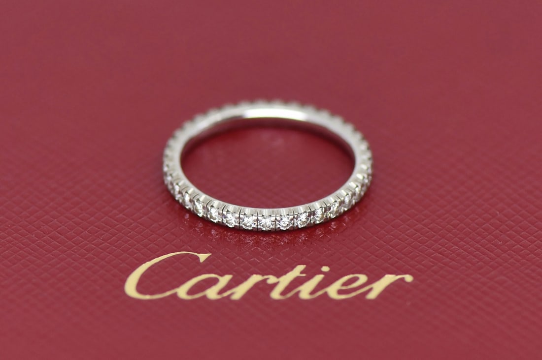 Cartier Etincelle 18K White Gold Diamond Band Size 49: Cartier Etincelle 18K White Gold Diamond Band Size 49 This Cartier Etincelle ring is crafted from 18K white gold and features a diamond as the main stone. The ring is a size 49 (US 4.75) and has a wid