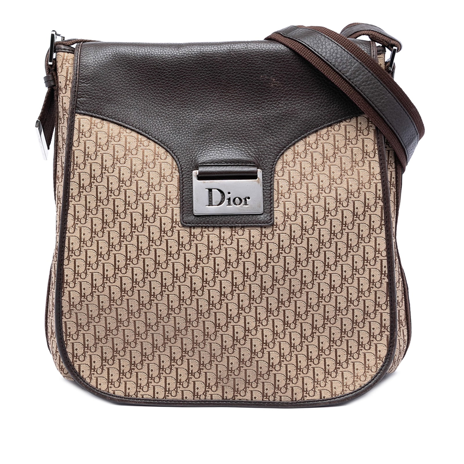 Diorissimo Trotter Brown Canvas Crossbody Bag: Diorissimo Trotter Brown Canvas Crossbody Bag This Diorissimo Trotter Canvas Street Chic Crossbody bag showcases a canvas body with leather trim, complemented by a flat strap and a front flap with mag