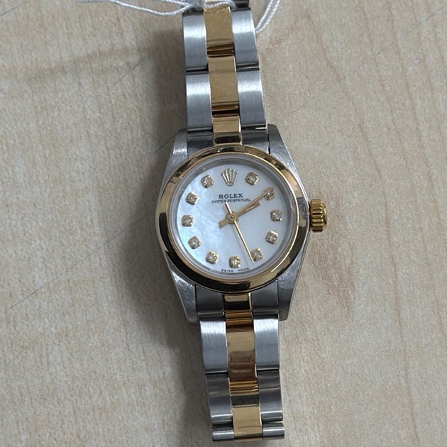 Ladies Rolex Oyster Perpetual 67183 White MOP Diamond Dial Oyster Bracelet: Ladies Rolex Oyster Perpetual 67183 White MOP Diamond Dial Oyster Bracelet This ladies Rolex Oyster Perpetual watch features a white mother-of-pearl dial accented with yellow diamond hour markers. It 