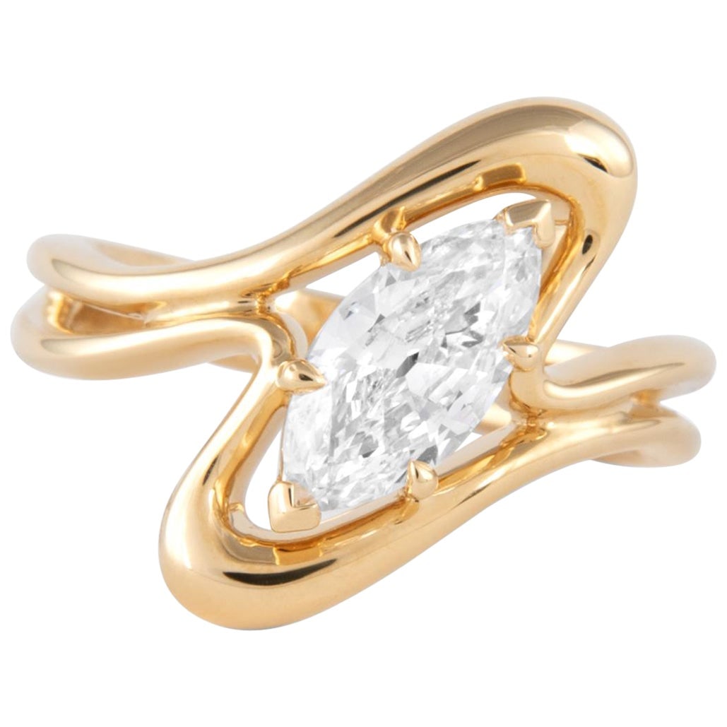 1.01ct Marquise Diamond Ring 18k Yellow Gold: 1.01ct Marquise Diamond Ring 18k Yellow Gold This stunning modern abstract ring features a 1.01 ct marquise diamond, beautifully set in 18k yellow gold. The design is perfect for various occasions, in