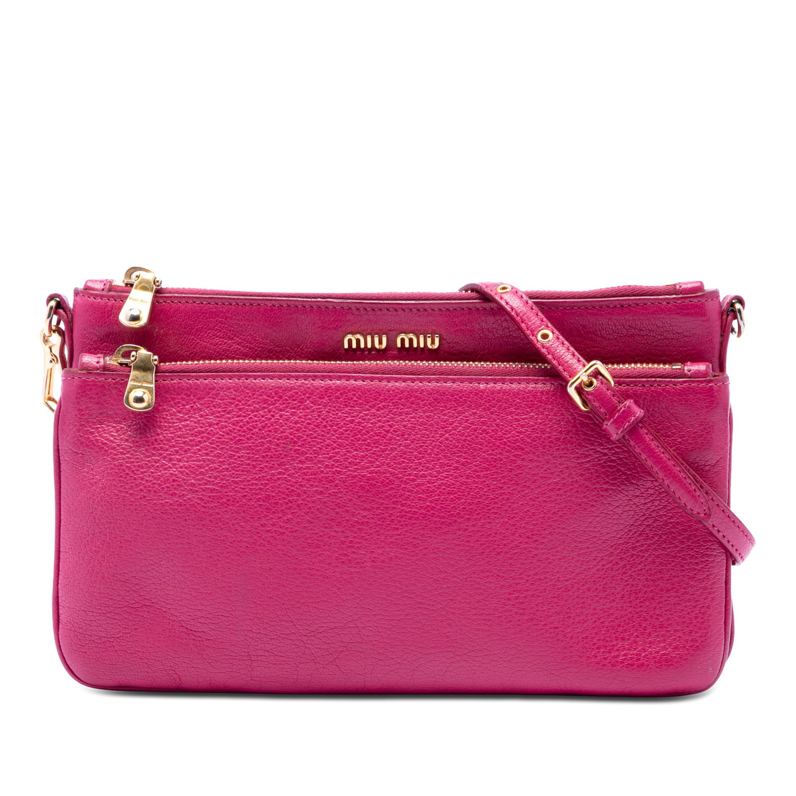 Miu Miu Madras Double Zip Goatskin Leather Crossbody Bag Pink: Miu Miu Madras Double Zip Goatskin Leather Crossbody Bag Pink This Miu Miu crossbody bag is crafted from goatskin leather in pink and features a top zip closure, an exterior front zip compartment, and