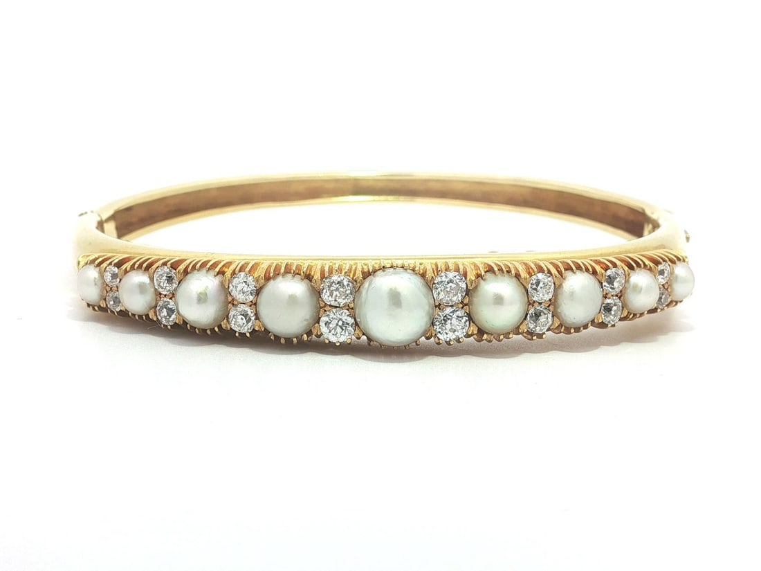 Victorian Era Yellow Gold Bangle With GIA Certified Natural Pearls and Old Mine Diamonds: Victorian Era Yellow Gold Bangle With GIA Certified Natural Pearls and Old Mine Diamonds This antique Victorian bangle bracelet features nine natural saltwater pearls, each with a round button shape a