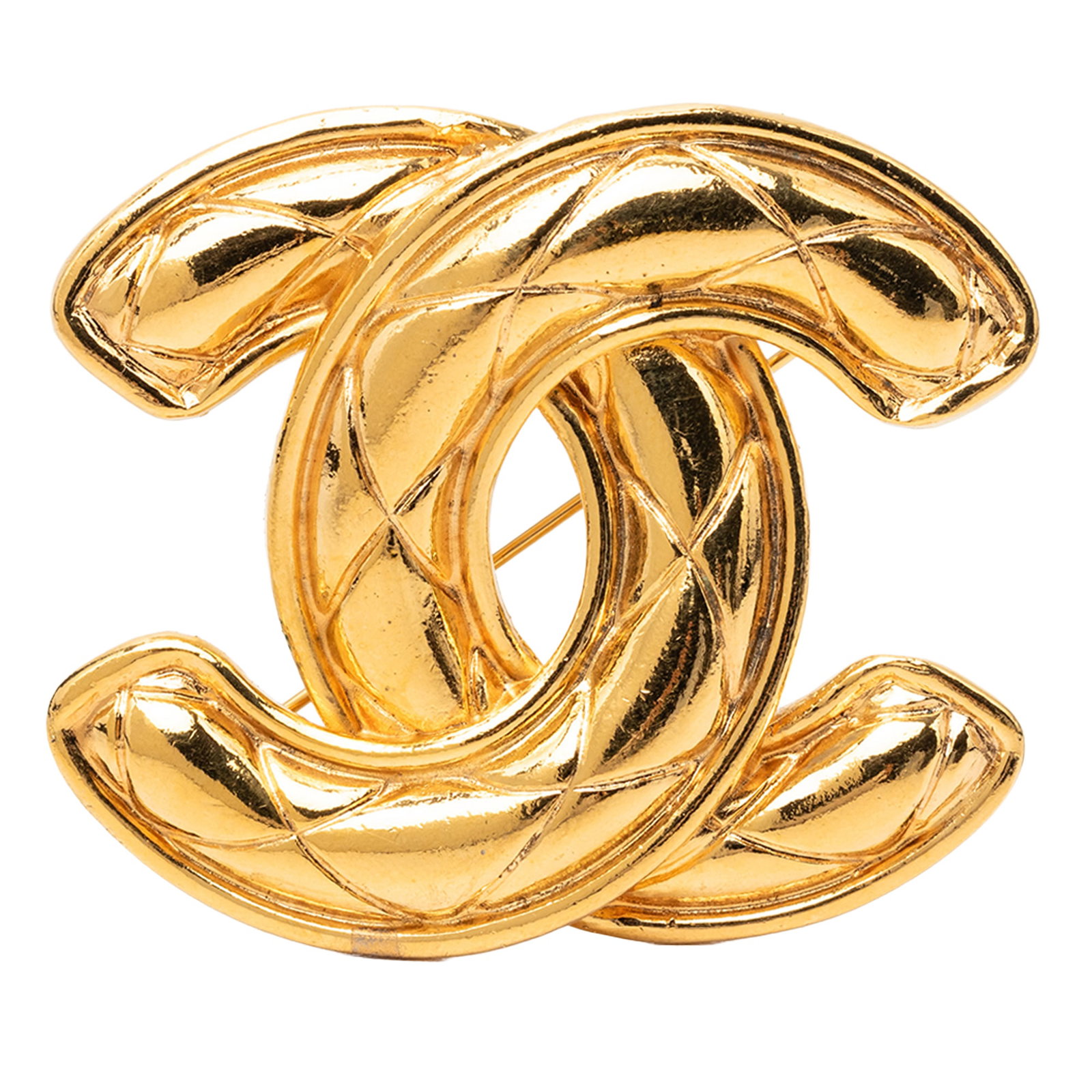 Chanel CC Quilted Gold Plated Metal Brooch: Chanel CC Quilted Gold Plated Metal Brooch Gold plated quilted brooch with a back pin closure. It is a costume accessory made of metal, with origin stated as France. Condition is AB, with exterior bac