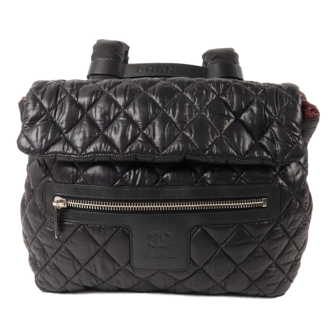 Nylon Backpack CHANEL Coco Cocoon Black with CC Silver Tone Hardware: Nylon Backpack CHANEL Coco Cocoon Black with CC Silver Tone Hardware Black CHANEL Coco Cocoon backpack in nylon with silver-tone hardware. It features a magnetic pocket, outside zip pocket, and