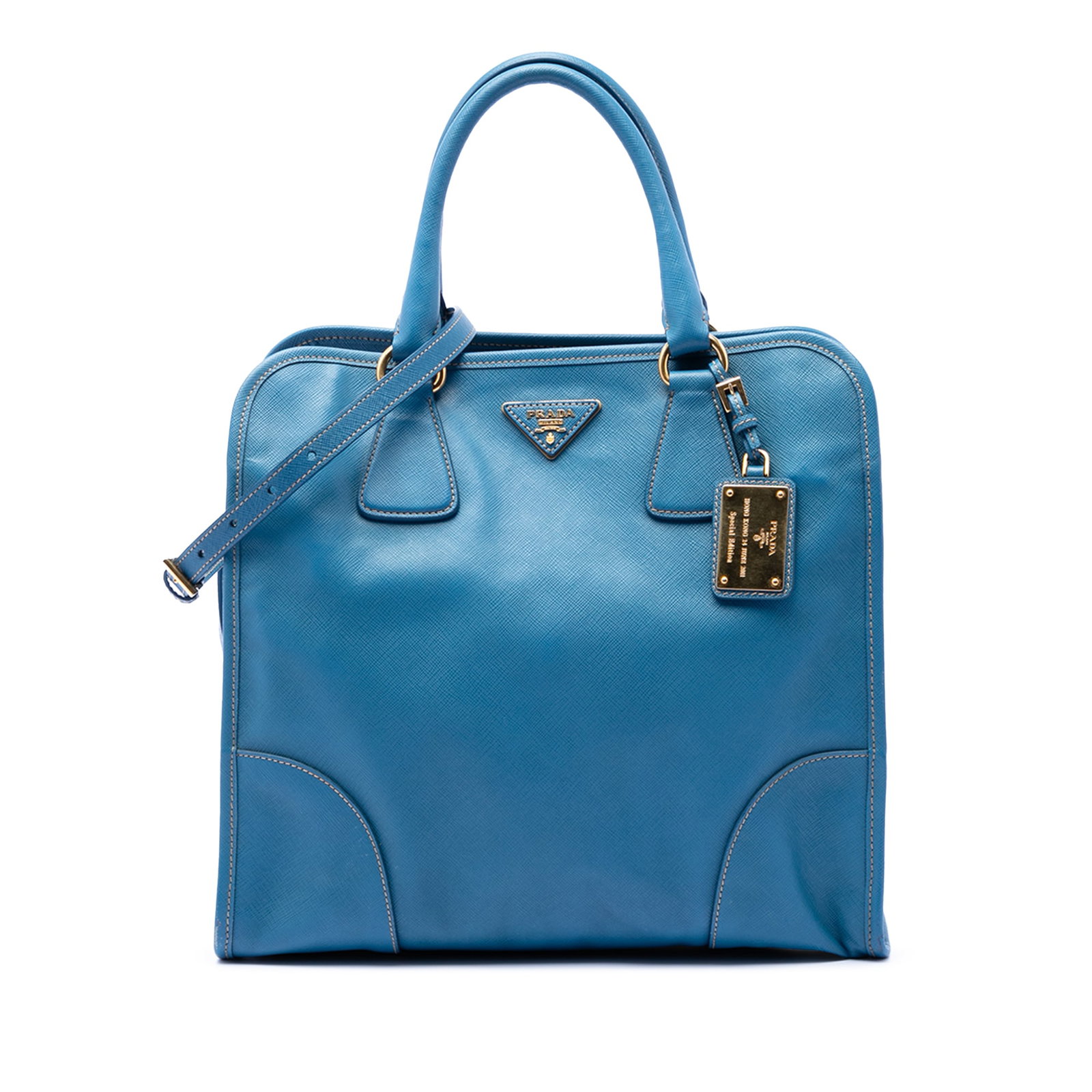 Prada blue Saffiano leather tote with strap: Prada blue Saffiano leather tote with strap This Prada Saffiano Lux Shopping Tote is crafted from blue saffiano leather and features rolled leather handles, a detachable and adjustable flat leather st