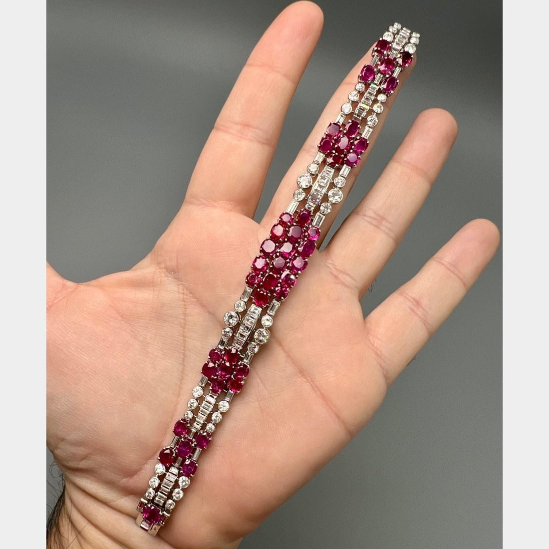 Platinum Art Deco Bracelet with GIA Burma No-Heat Rubies and Diamonds: Platinum Art Deco Bracelet with GIA Burma No-Heat Rubies and Diamonds This French Art Deco bracelet is crafted from platinum and features 41 Burma no-heat rubies totaling approximately 22.50 carats, w
