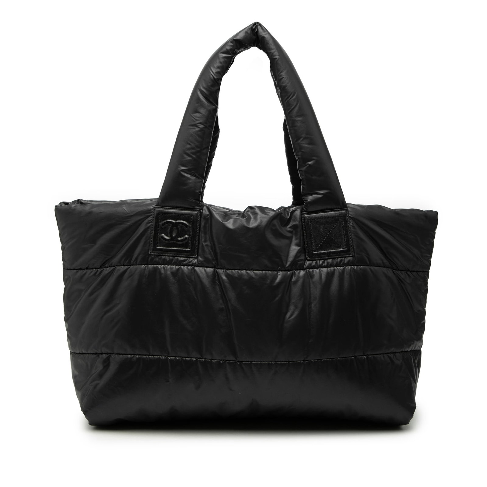 Chanel Coco Cocoon Medium Black Quilted Nylon Tote Bag: Chanel Coco Cocoon Medium Black Quilted Nylon Tote Bag This Chanel Medium Quilted Nylon Coco Cocoon Tote features a black quilted nylon body with matching nylon handles, an open top secured by a lobst