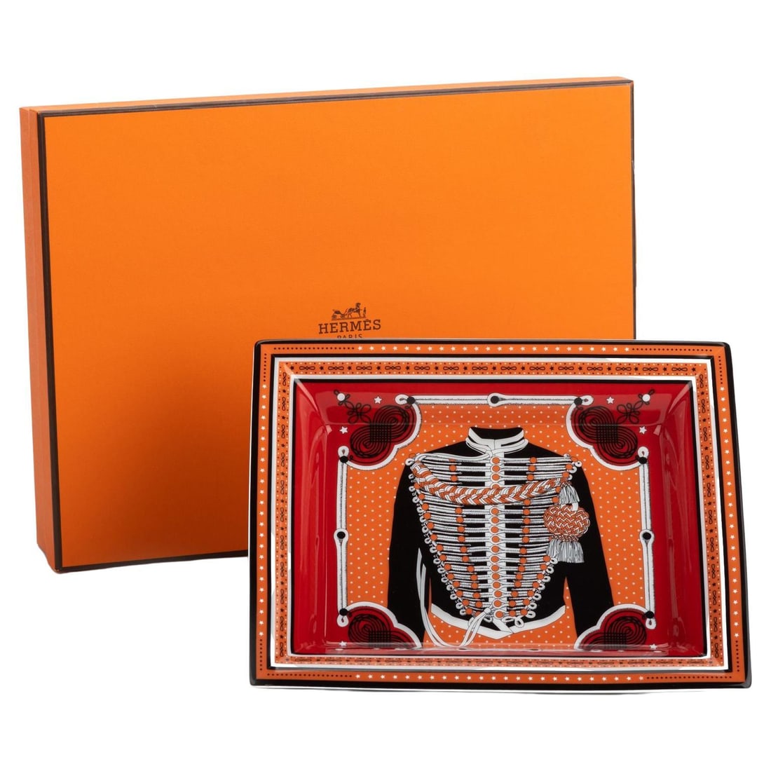 Hermes Brandeburg Ashtray Red Orange with Jacket Print: Hermes Brandeburg Ashtray Red Orange with Jacket Print This exquisite Hermes Brandeburg Ashtray features a vibrant red and orange design, making it a striking addition to any decor. The center showcas