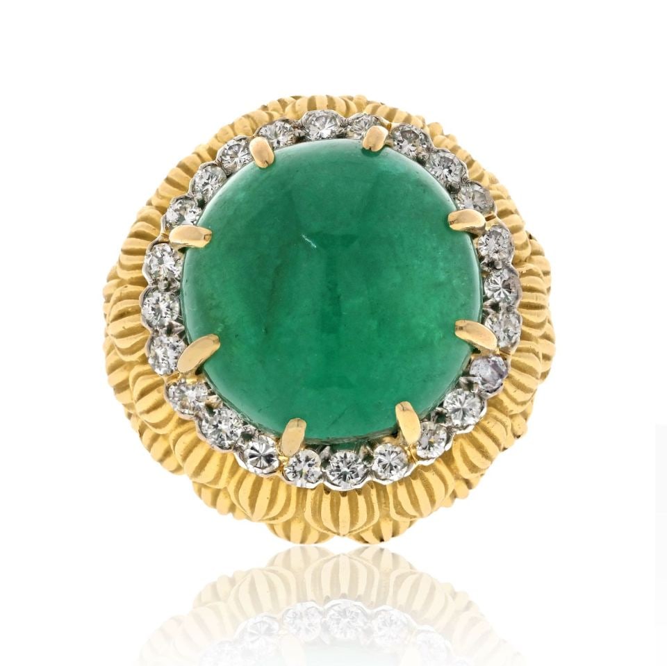 David Webb Platinum 18K Yellow Gold 24ct Emerald Diamond Ring: David Webb Platinum 18K Yellow Gold 24ct Emerald Diamond Ring This exquisite estate ring by David Webb showcases a stunning cabochon green emerald, weighing an impressive 24 carats, accented by sparkl