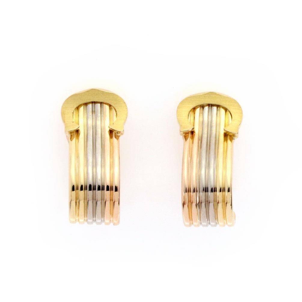 Cartier Double C Huggie Earrings 18k Tri-Color Gold with Paper: Cartier Double C Huggie Earrings 18k Tri-Color Gold with Paper Elevate your accessory collection with these authentic Cartier Double C Earrings, expertly crafted from luxurious 18k tri-color gold, fea