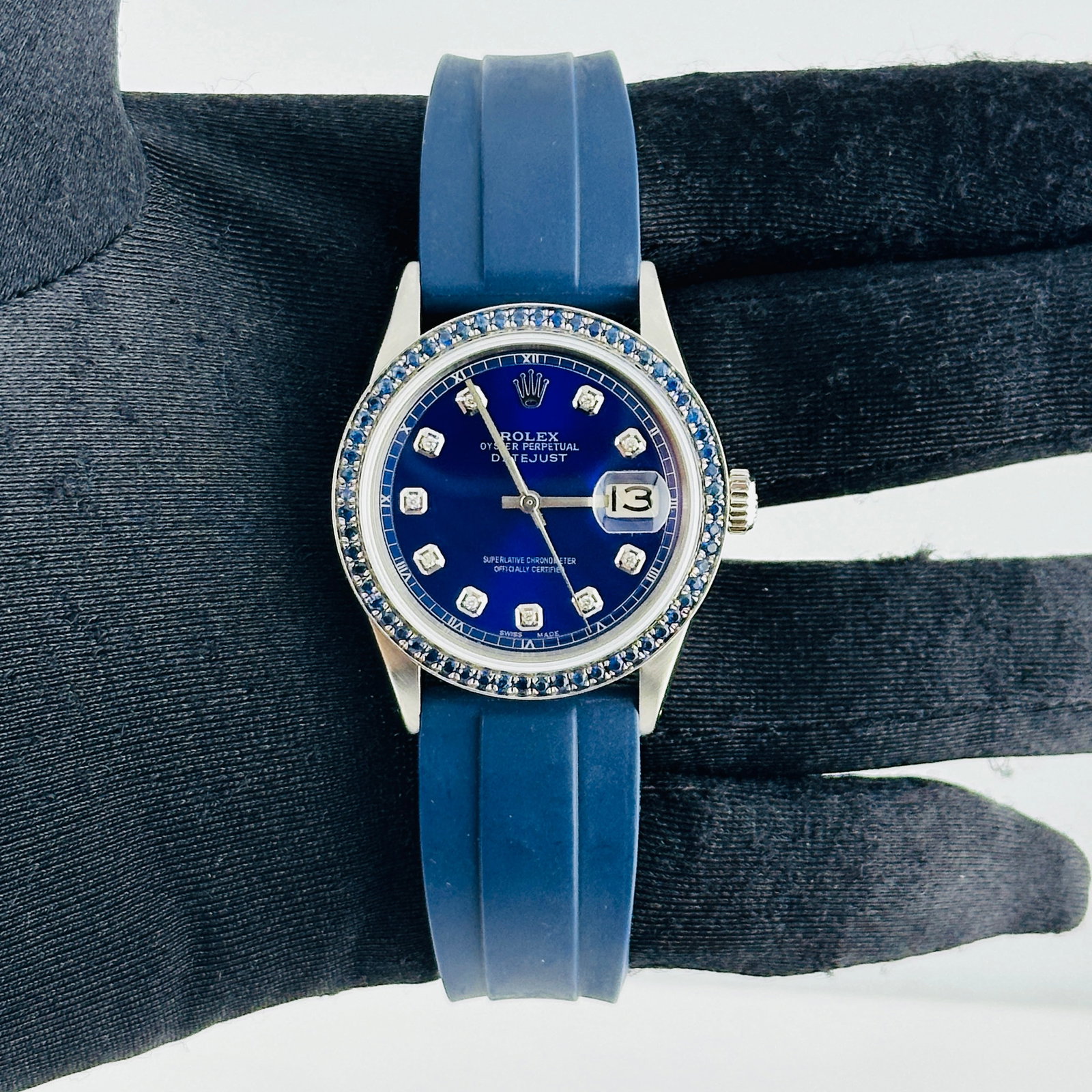 Rolex Datejust Reference 1603 Watch With Aftermarket Blue Diamond Dial and Rubber Band: Rolex Datejust Reference 1603 Watch With Aftermarket Blue Diamond Dial and Rubber Band This Rolex Datejust features an aftermarket blue diamond dial and a pave blue diamond bezel, complemented by an a