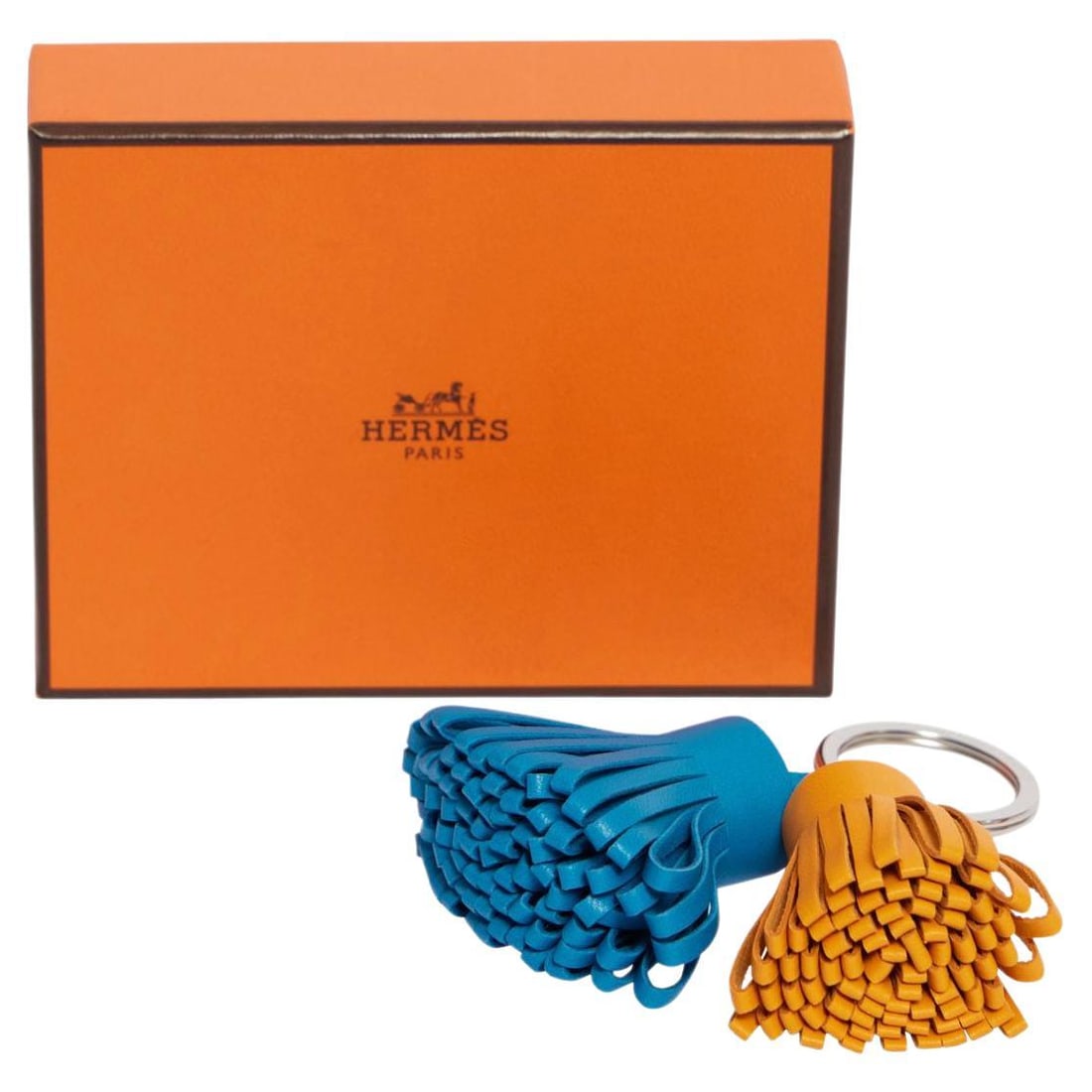 Hermes Double Carmen Tassel Keychain Curry Blue Leather: Hermes Double Carmen Tassel Keychain Curry Blue Leather Enhance your collection with the exquisite Hermes Double Carmen Bag Charm, a stunning accessory crafted from high-quality curry and blue leather