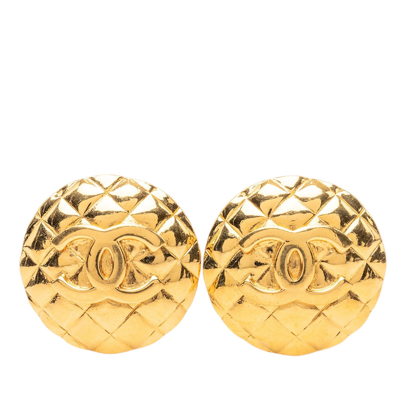 Chanel CC Round Clip On Earrings Gold Plated Quilted Metal: Chanel CC Round Clip On Earrings Gold Plated Quilted Metal Round clip-on earrings with a quilted CC design in gold-plated metal. Made in France, this costume jewelry pair shows visible wear including 