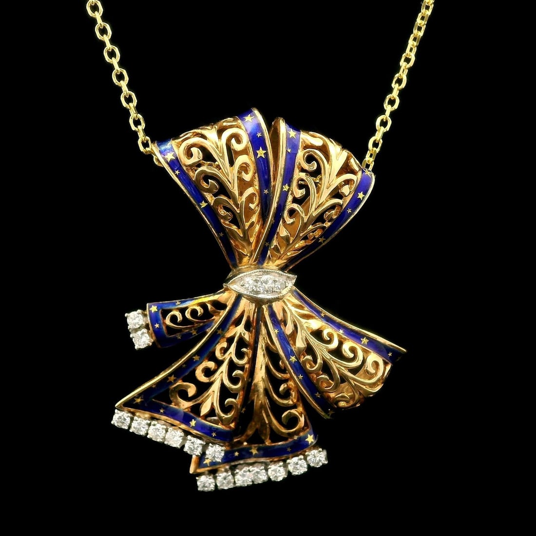 Elegant Yellow Gold 0.50ct Diamond Blue Enamel Ribbon Pendant Necklace: Elegant Yellow Gold 0.50ct Diamond Blue Enamel Ribbon Pendant Necklace This exquisite necklace features a stunning open work slide ribbon pendant crafted in solid yellow gold with white gold accents a