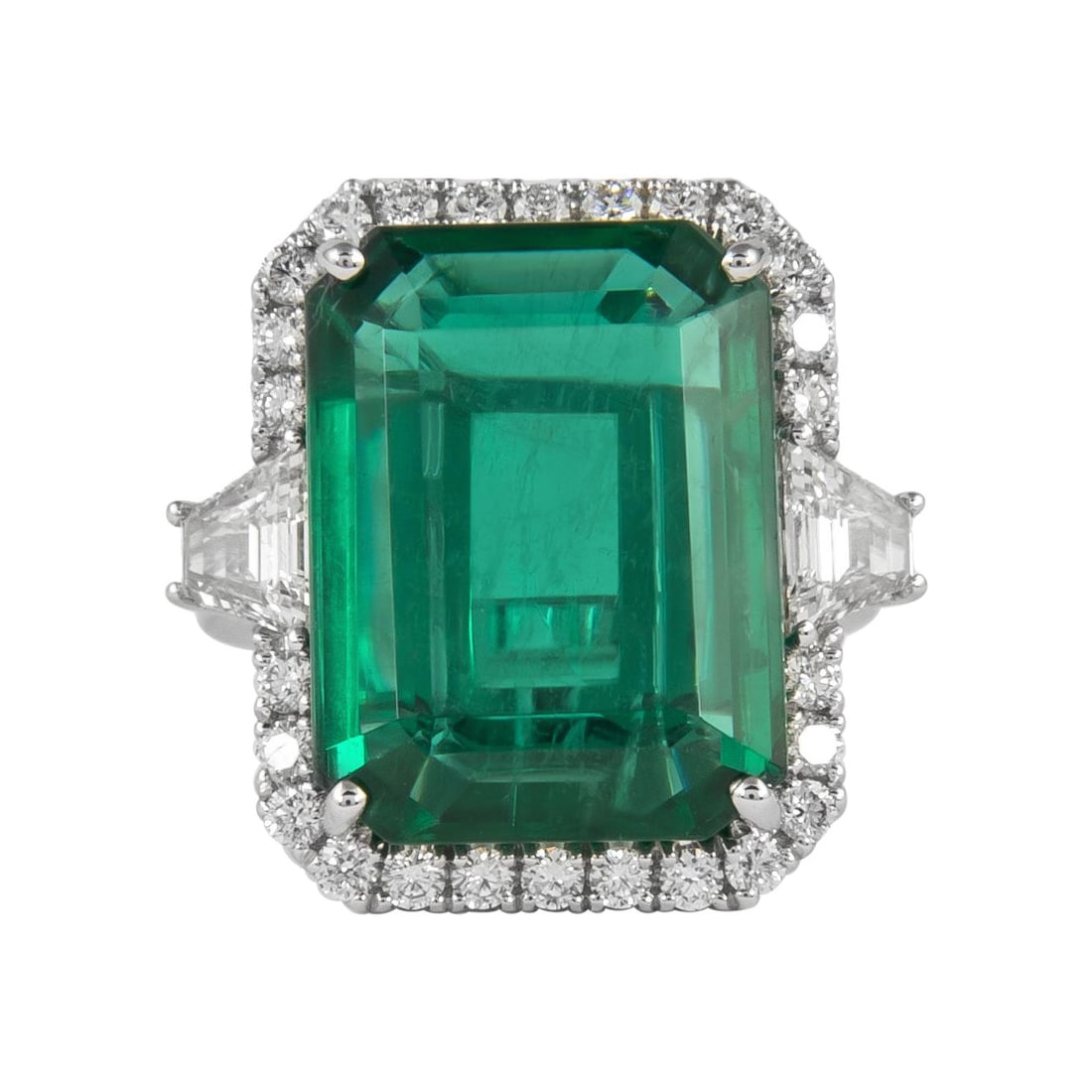 18k White Gold Halo Ring with GIA 13.18ct Emerald: 18k White Gold Halo Ring with GIA 13.18ct Emerald This exquisite three stone halo ring features a stunning 13.18 carat GIA certified emerald cut emerald, displaying a remarkable color that appears to 