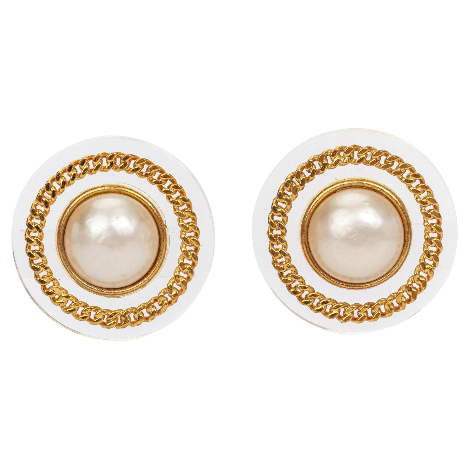 Vintage Chanel Clip Earrings With Lucite Gold Chain and Mabe Pearls 1970s: Vintage Chanel Clip Earrings With Lucite Gold Chain and Mabe Pearls 1970s Rare vintage Chanel clip back earrings from the 1970s, featuring clear lucite with gold chain accents and mabe pearls. These e