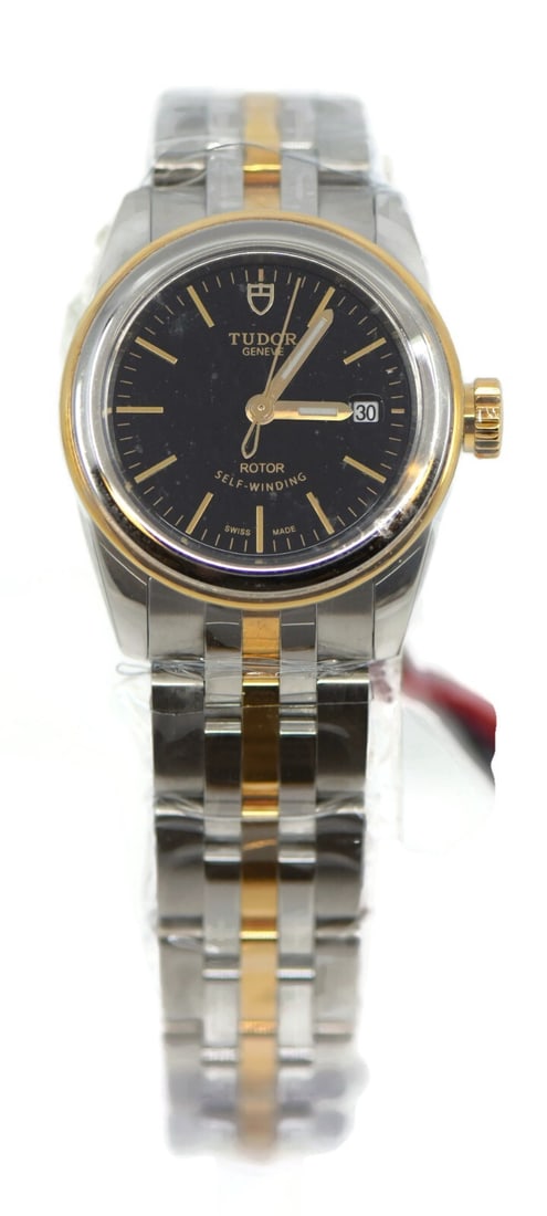 Tudor Glamour Date 18K Stainless Steel Watch 51003 with Box and Papers: Tudor Glamour Date 18K Stainless Steel Watch 51003 with Box and Papers Discover the exquisite Tudor Glamour Date wristwatch, a perfect blend of elegance and functionality. This stunning timepiece feat