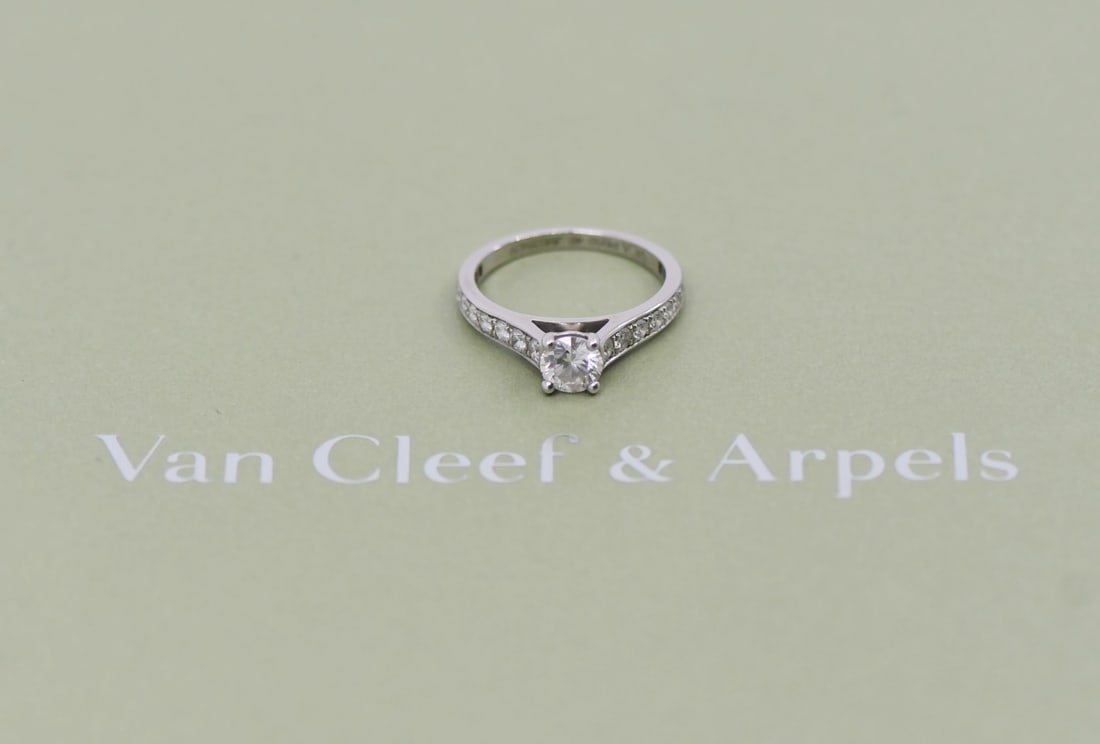 Van Cleef & Arpels Romance 0.40 E/VVS2 Platinum Engagement Ring Size 4: Van Cleef & Arpels Romance 0.40 E/VVS2 Platinum Engagement Ring Size 4 This exquisite Van Cleef & Arpels Romance engagement ring showcases a stunning 0.40 carat round diamond with an E color and VVS2 