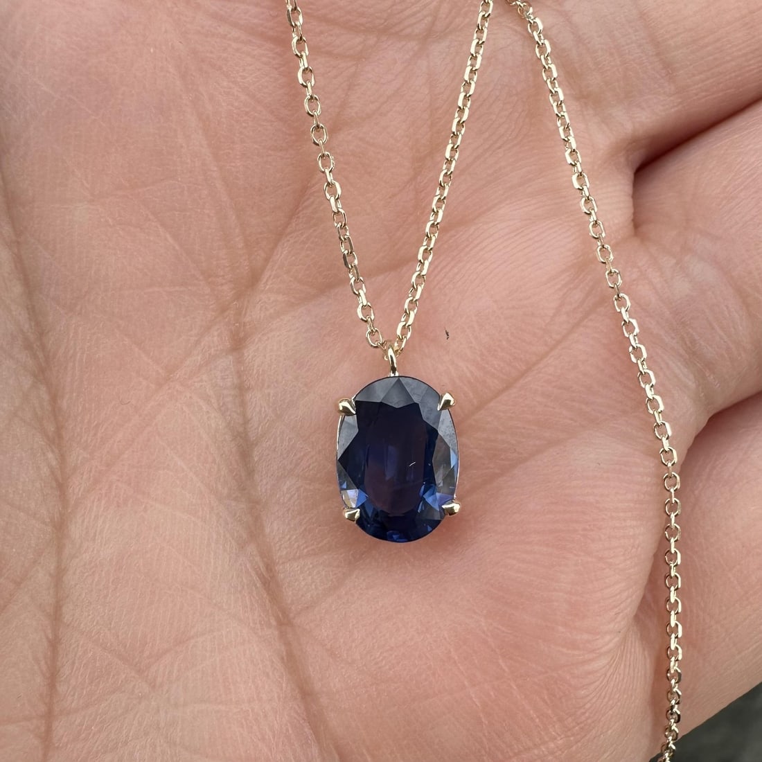 GIA Certified 1.77ct Blue Oval Sapphire 14k Gold Solitaire Pendant Necklace: GIA Certified 1.77ct Blue Oval Sapphire 14k Gold Solitaire Pendant Necklace This un-used pendant features a natural deep blue sapphire, oval brilliant cut and prong set, weighing exactly 1.77 carats. 