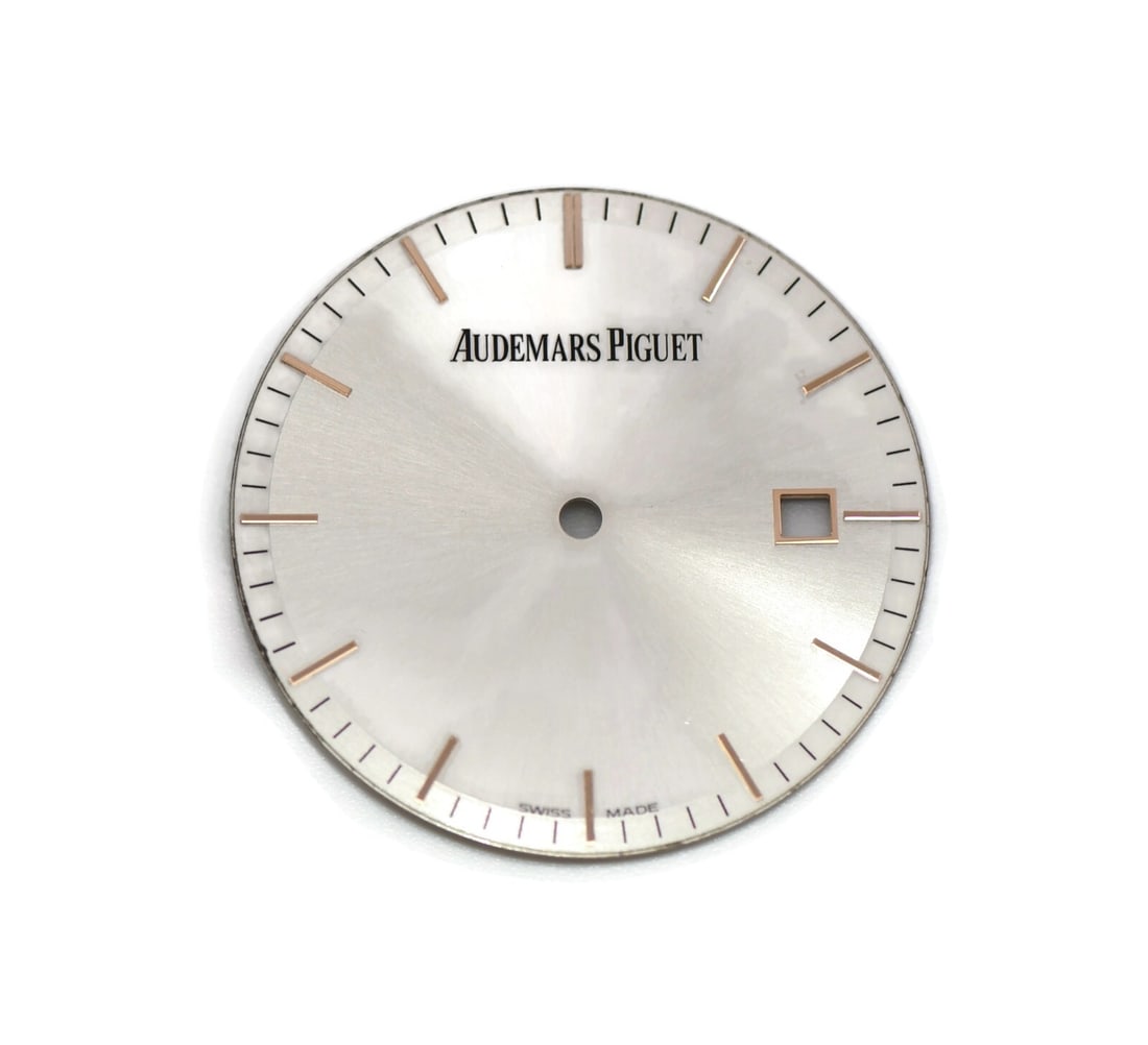 32mm Silver Watch Dial for Audemars Piguet Timepiece: 32mm Silver Watch Dial for Audemars Piguet Timepiece This is an authentic Audemars Piguet silver dial, designed for precision and style. Manufactured in Switzerland, this pre-owned dial measures 32mm 
