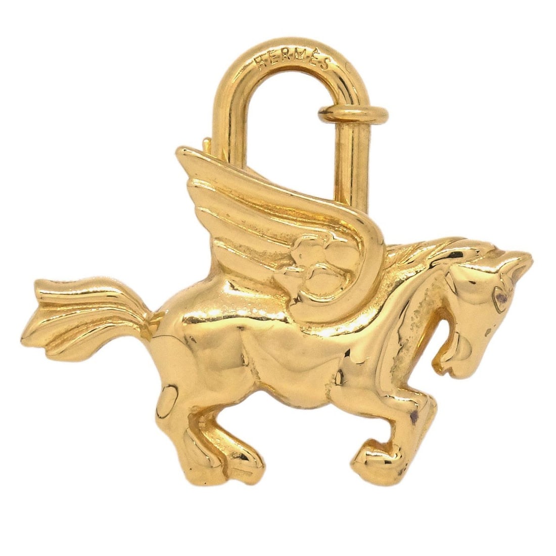 Hermes Le Cheval Pegasus Cadena Small Gold Plated Charm 1993: Hermes Le Cheval Pegasus Cadena Small Gold Plated Charm 1993 Vintage Hermes Le Cheval Pegasus Cadena charm from 1993 in gold-plated metal. This small unisex charm features the Pegasus motif and comes 